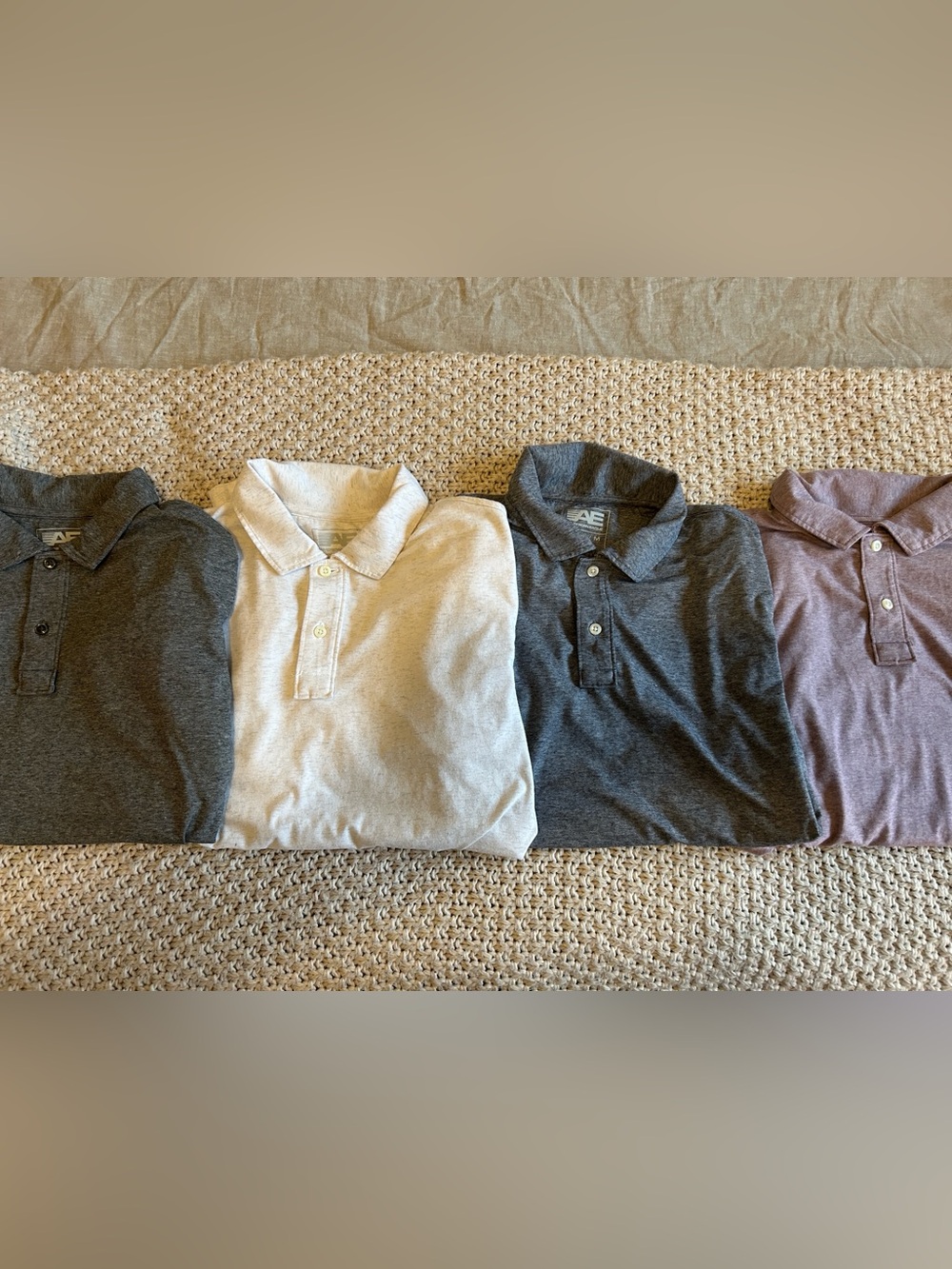 American Eagle Performance Polo Bundle.  Four Polos. Lavender, Cream, Gray, Navy
